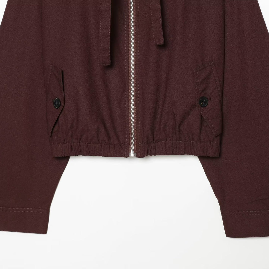 Women's short bomber-style jacket with high funnel collar, concealed zipper, and flap pockets Mune Fashion