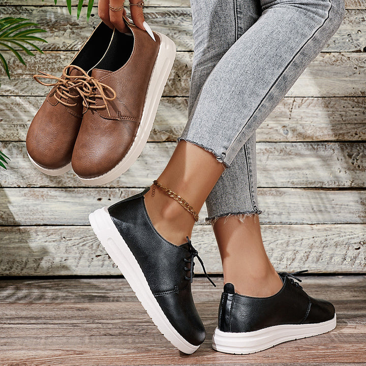 Women's lace-up sneakers made of synthetic leather with a cushioned comfort footbed and light profile sole Mune Fashion
