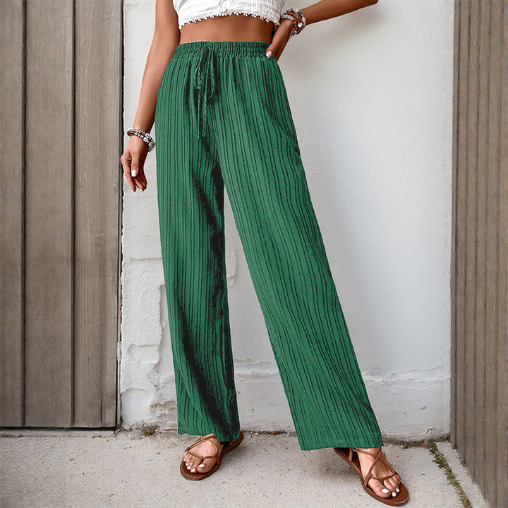 Women's loose summer trousers made from lightweight crinkle fabric with elastic waistband and drawstring.