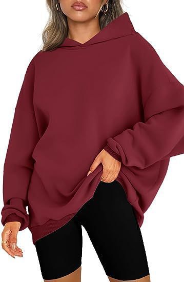 Women's oversized hoodie in longline cut with raglan sleeves and soft inner lining Mune Fashion