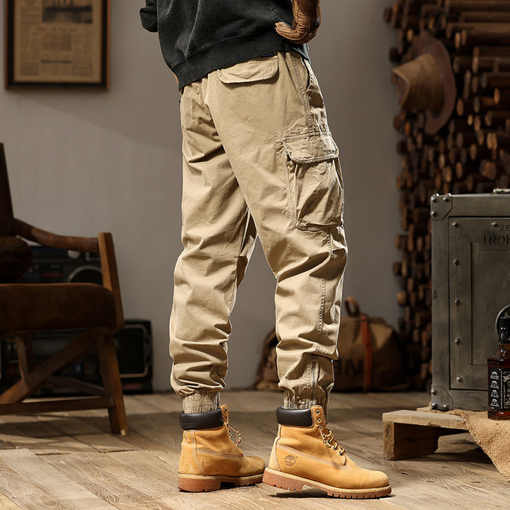 Herren Konisch geschnittene Utility-Cargo-Jogginghose mit Tunnelzugbund, Klapptaschen und Knöchelreißverschlüssen Mune Fashion