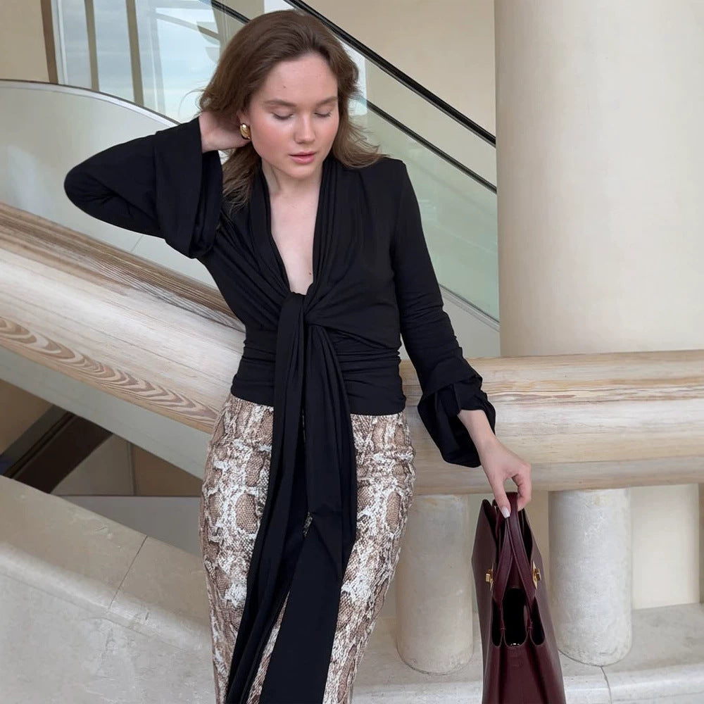 Women's wrap blouse with deep V-neck, long tie ribbons and ruffle sleeves Mune Fashion