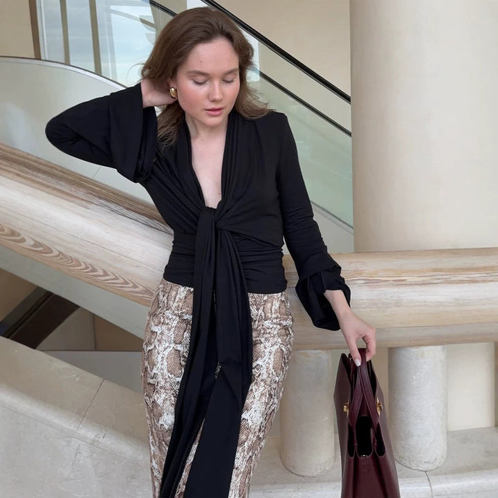 Women's wrap blouse with deep V-neck, long tie ribbons and ruffle sleeves Mune Fashion