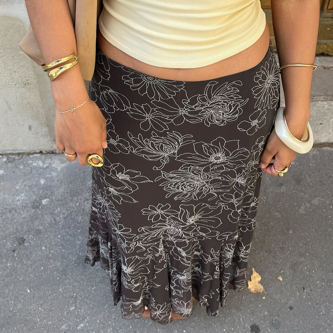 Women’s midi skirt with flared ruffle hem and floral contour print Mune Fashion