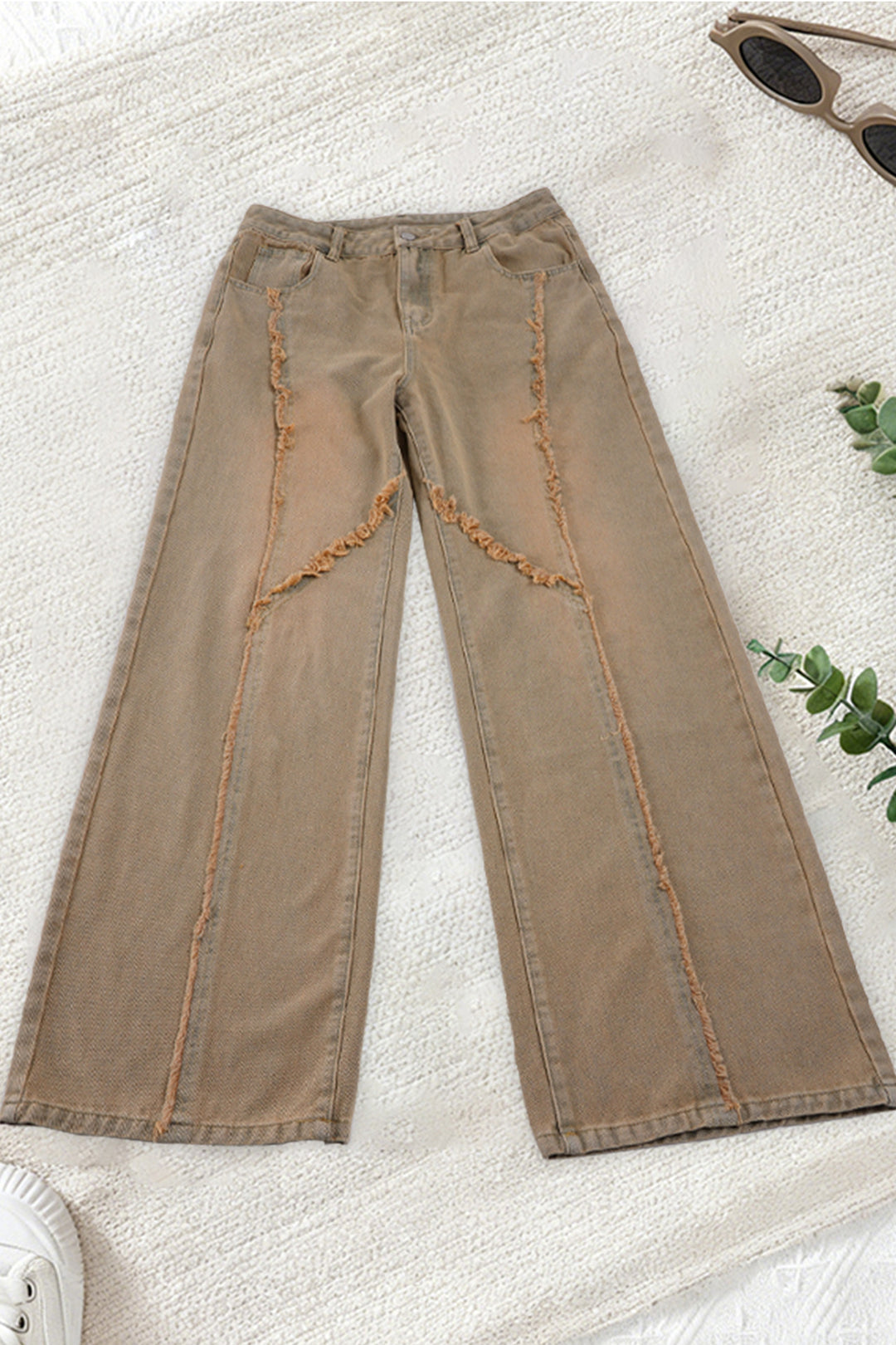 Women's high-waisted wide-leg jeans with raw hem seams, diagonal fringe trim, and relaxed fit Mune Fashion