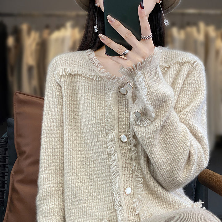 Women's knitted cardigan with fringe trim, mother-of-pearl button placket, and patch pockets Mune Fashion
