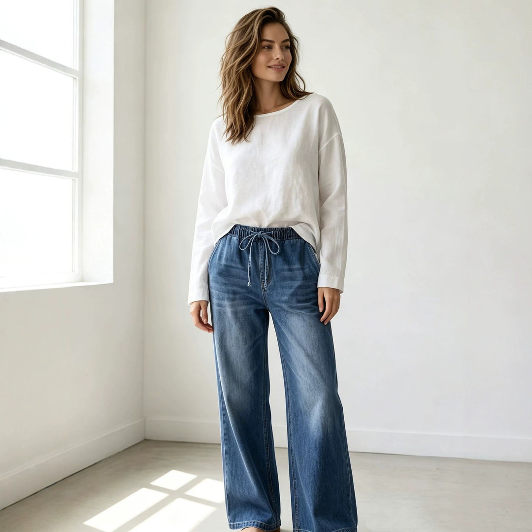 Women's Relaxed-Fit Denim Pants with elastic drawstring waistband, subtle used effect, and wide leg Mune Fashion