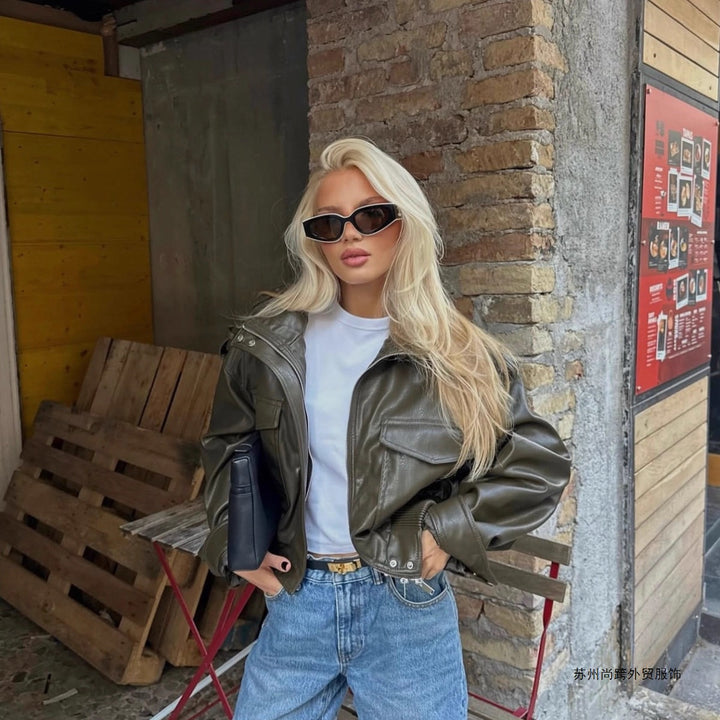 Women Short-Cut Leather Bomber with High Stand Collar, Shoulder Straps and Flap Pockets Mune Fashion