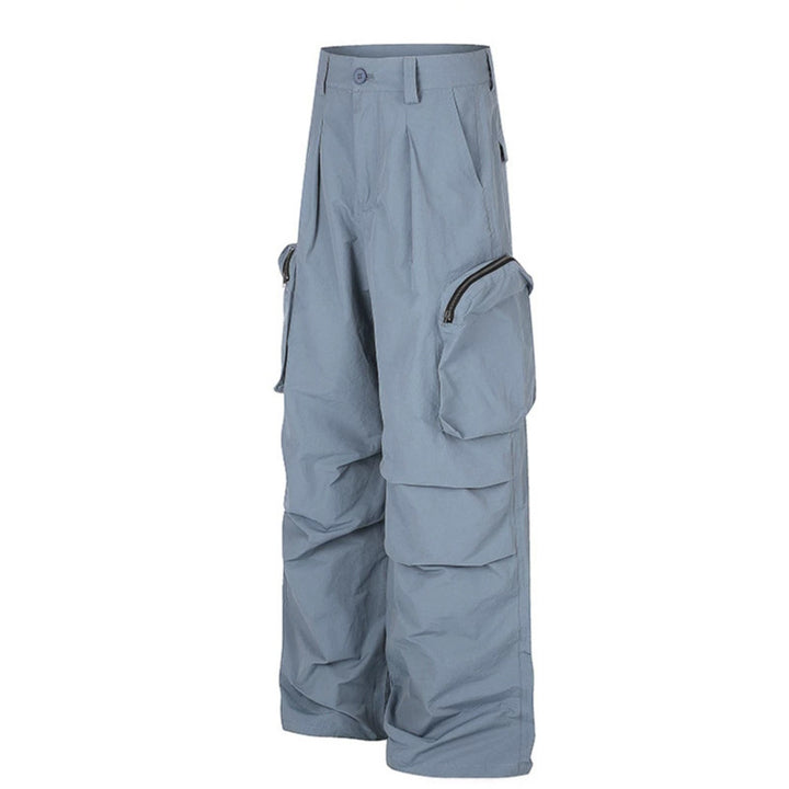 Women wide-cut cargo palazzo pants with high waist, zip pockets and layered panels Mune Fashion