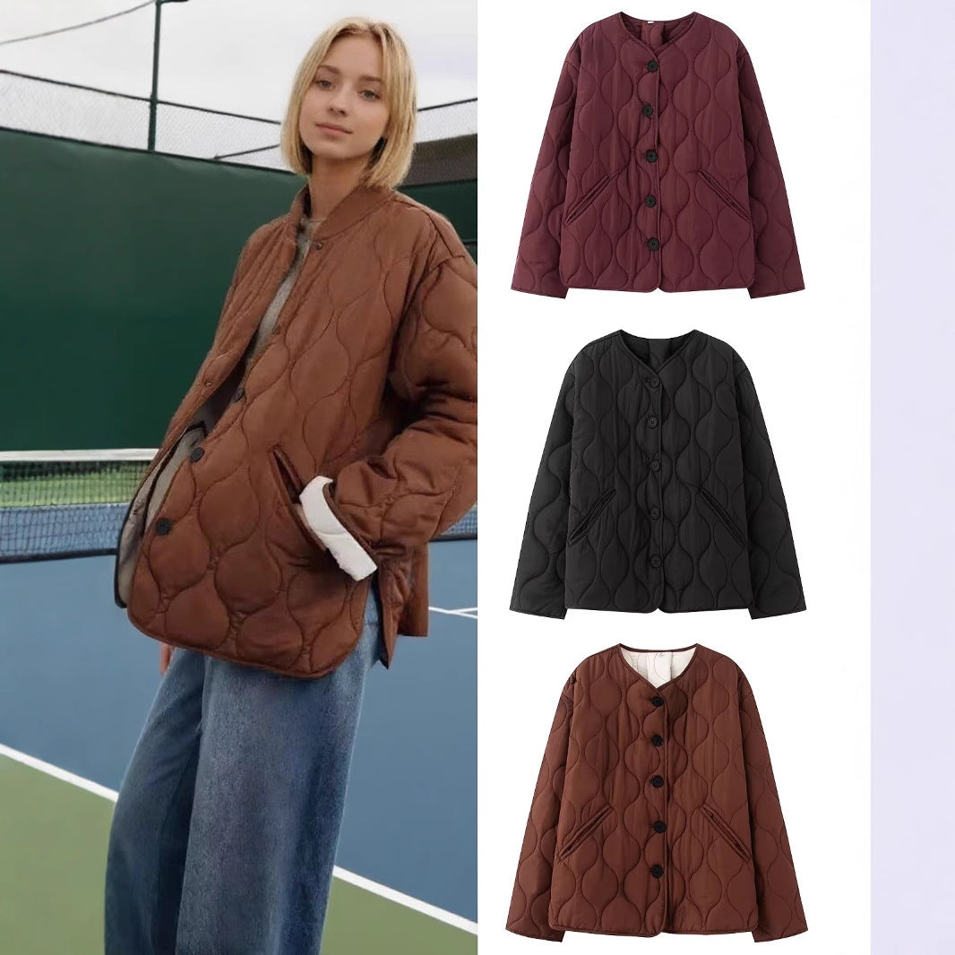 Women's quilted jacket without collar with round neckline, boxy cut and decorative wave quilting Mune Fashion
