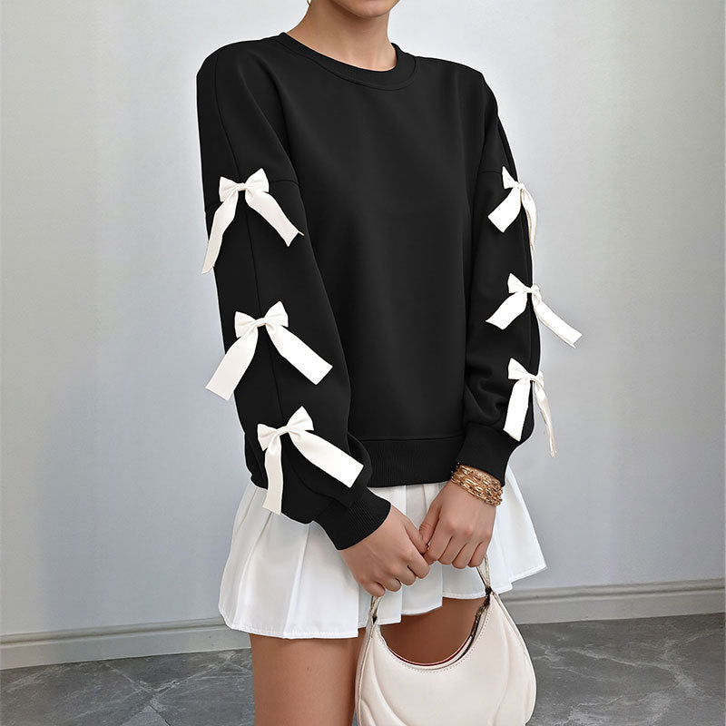 Women's sweatshirt with decorative bows on the sleeves Mune Fashion
