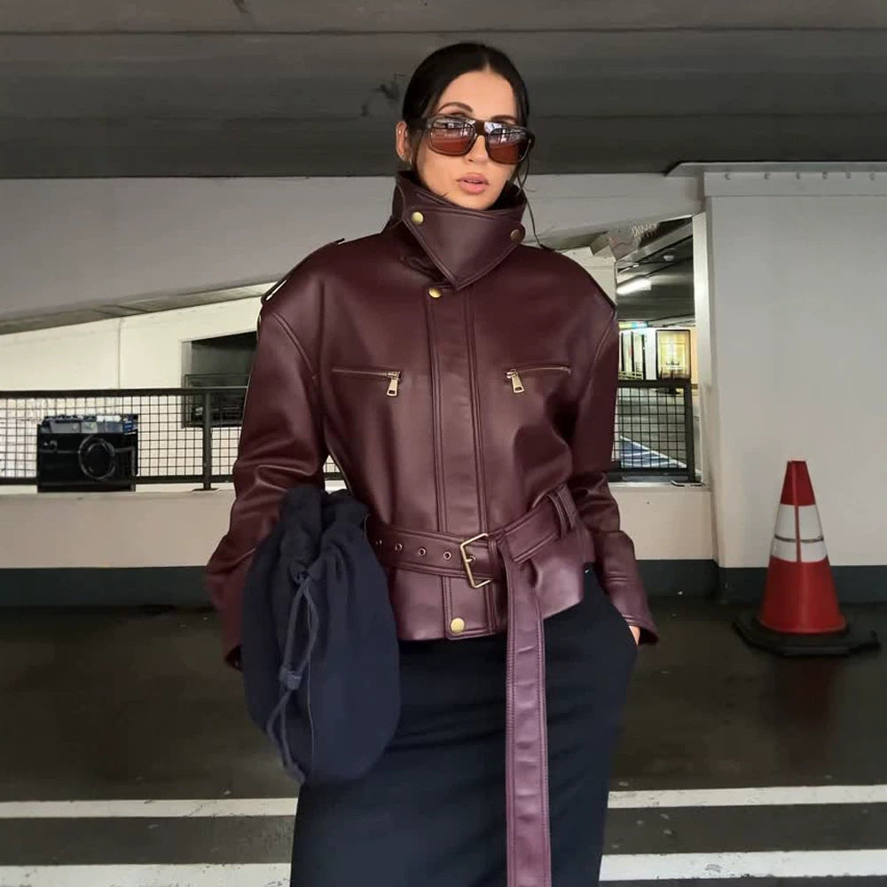 Women's fitted faux leather bomber jacket with high stand collar and tie belt Mune Fashion