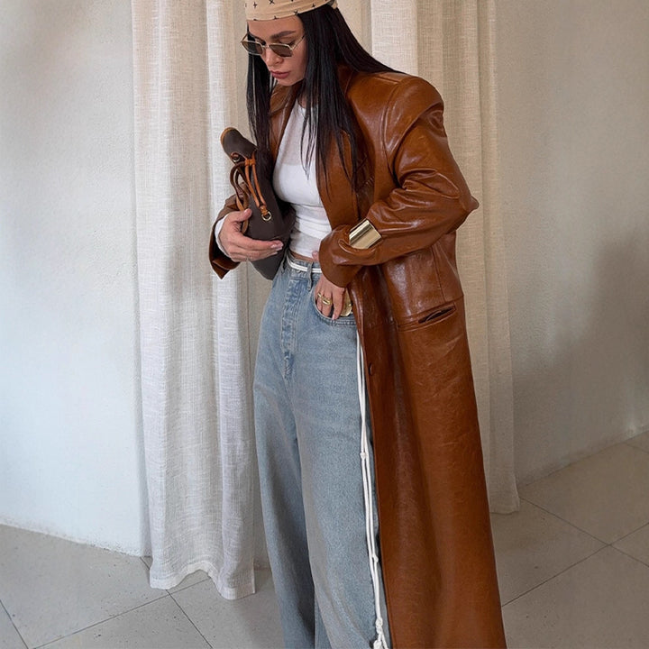 Women's long-cut patent leather trench coat with lapel collar and boxy oversized fit Mune Fashion