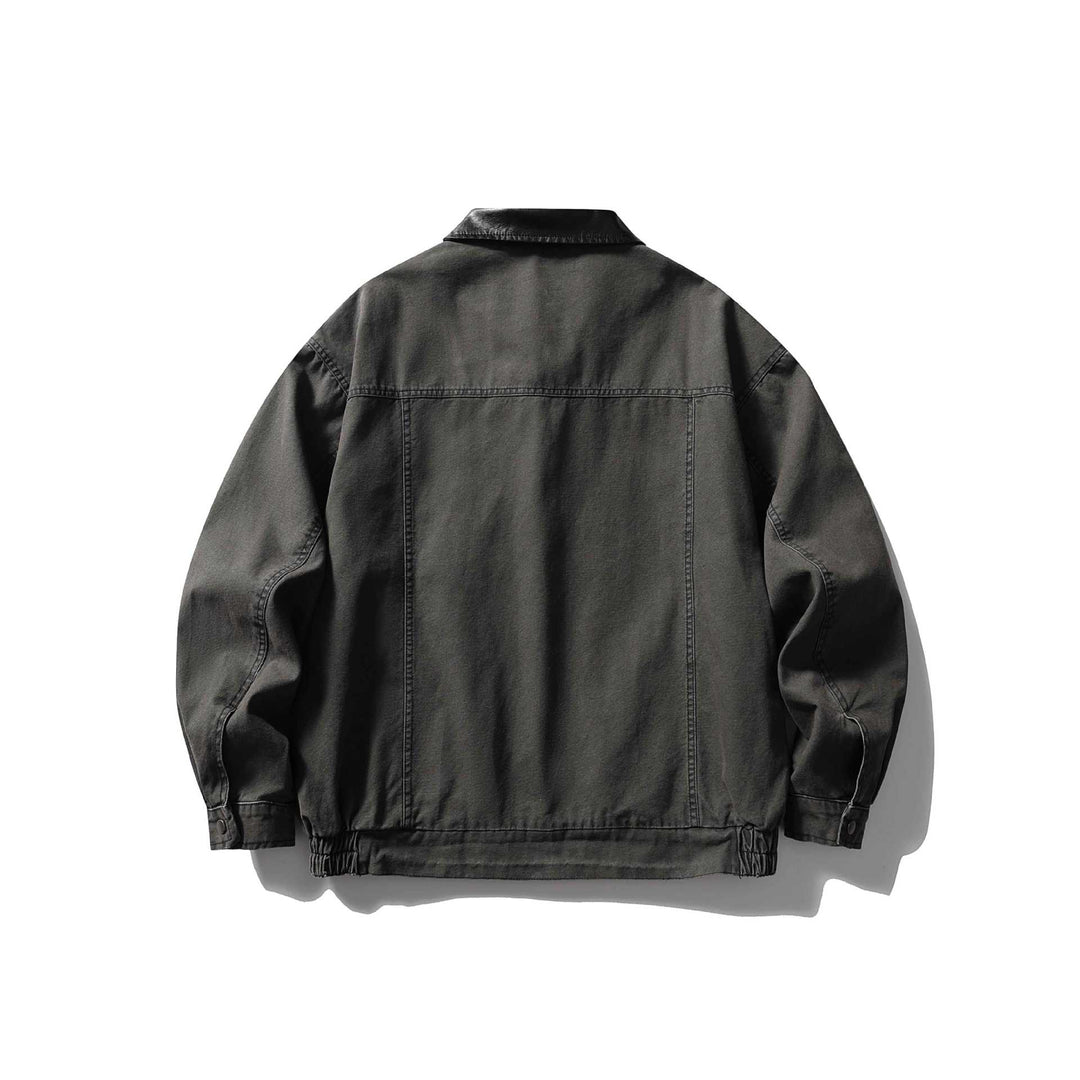 Men's tailored canvas blouson with contrasting leather collar and elastic hem.