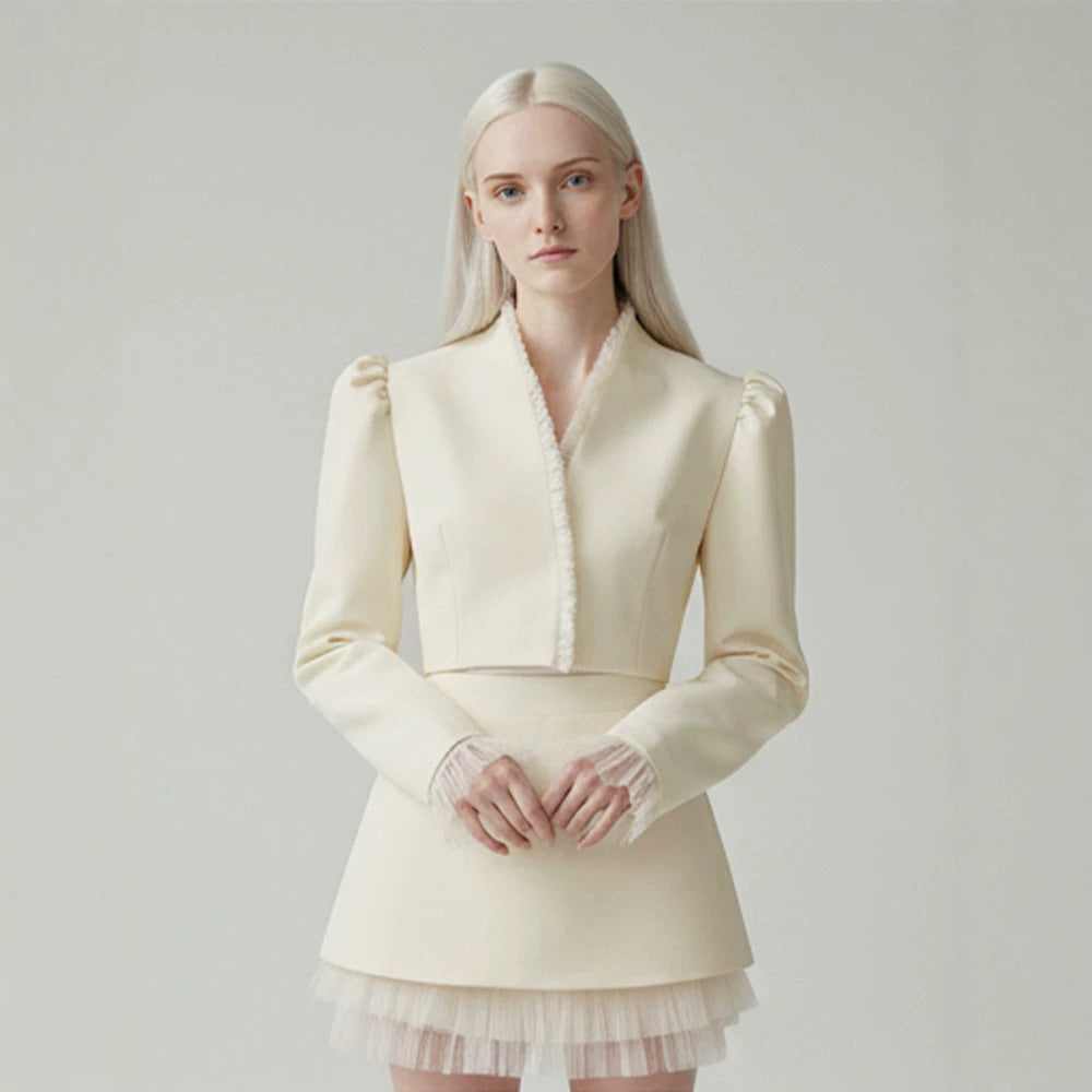 Ladies short blazer with tailored cropped silhouette, gathered shoulders and delicate tulle cuffs Mune Fashion