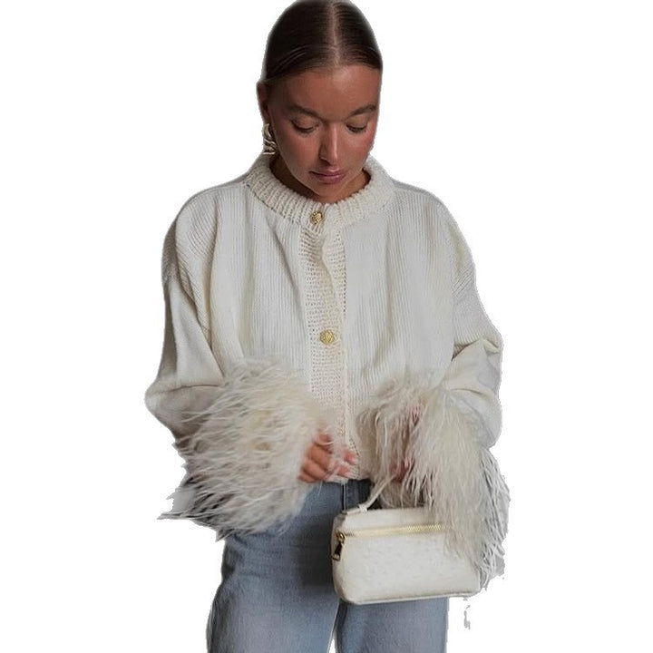 Women's knitted cardigan with feather trim at sleeve cuffs and golden decorative buttons Mune Fashion