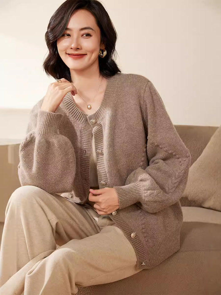 Women's knitted cardigan with textured pattern, balloon sleeves and pearly button placket Mune Fashion