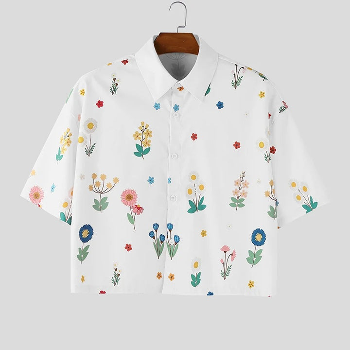 Women's loosely cut short sleeve shirt blouse with floral all-over print, shirt collar and short hem Mune Fashion