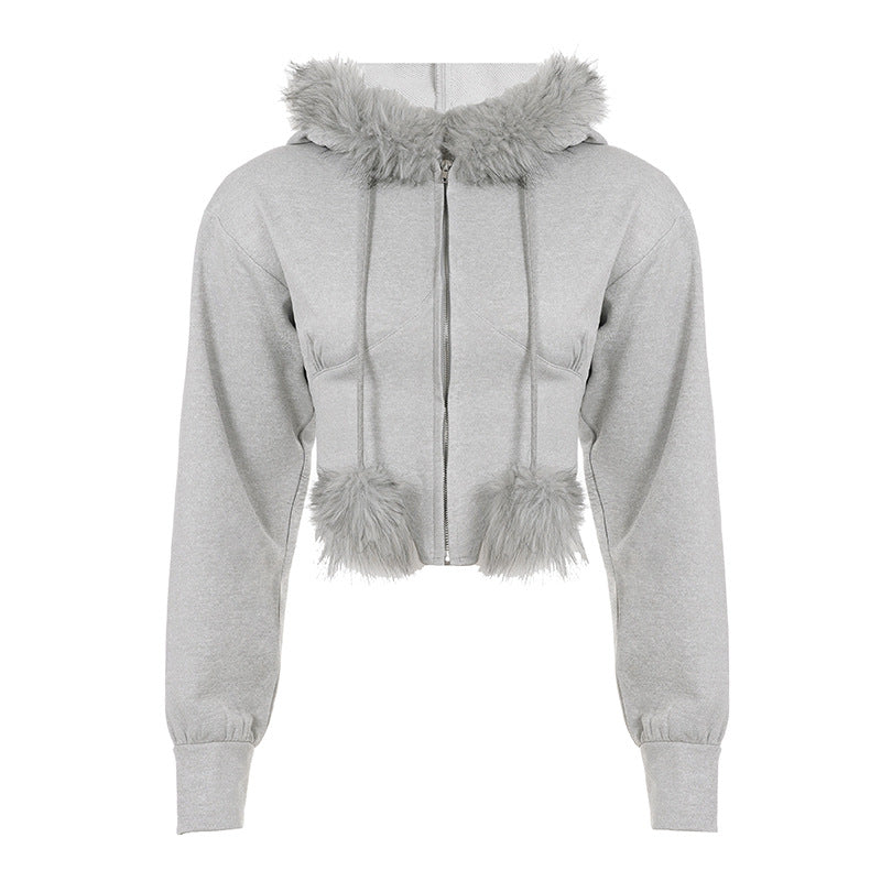 Women's cropped hoodie sweatshirt with faux fur trim, zipper, and pom-pom cords Mune Fashion