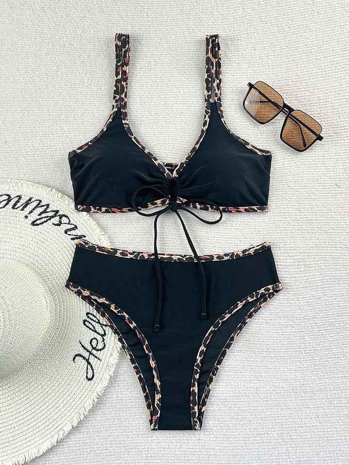 Women's triangle bikini with fashionable tie band and animalistic fringe detail Mune Fashion