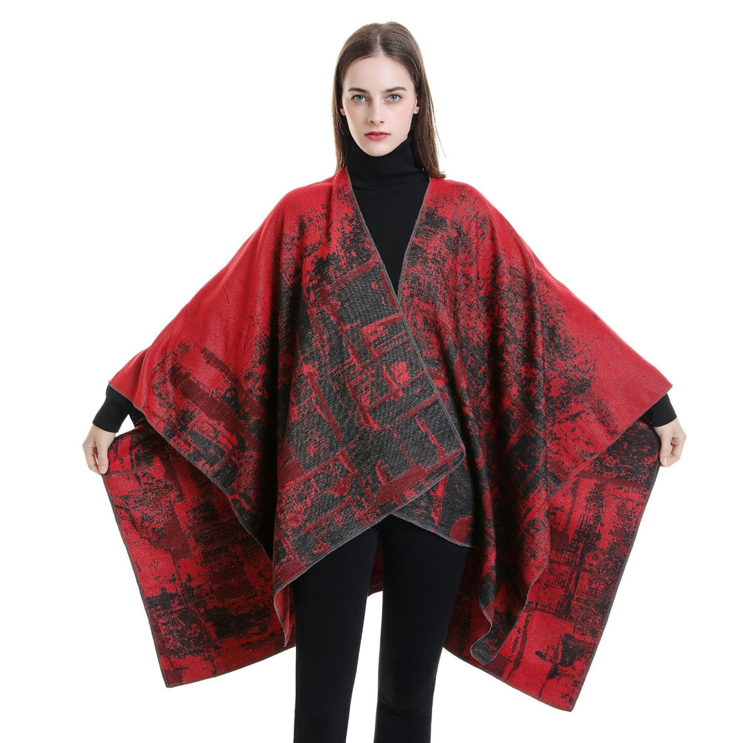 Women's wool blend cape with graphic jacquard, open kimono fall, and soft draping.