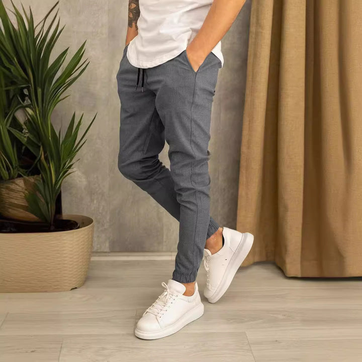 Men's slim fit jogging pants with elastic waistband, drawstring, and ribbed ankle cuff Mune Fashion