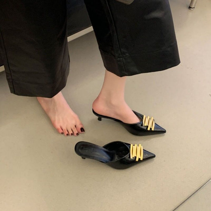 Ladies pointed toe leather look mules with sculpted kitten heel and gold wave appliqué Mune Fashion