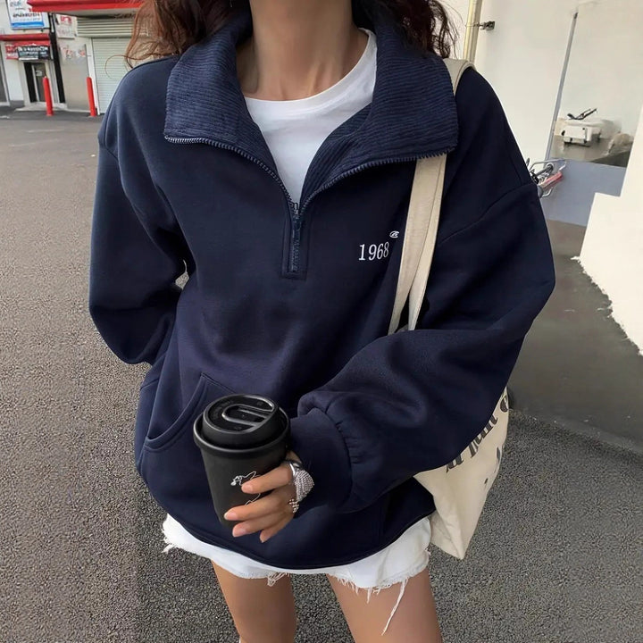 Women's oversized half-zip sweatshirt with high collar, kangaroo pocket, and casual oversized fit Mune Fashion