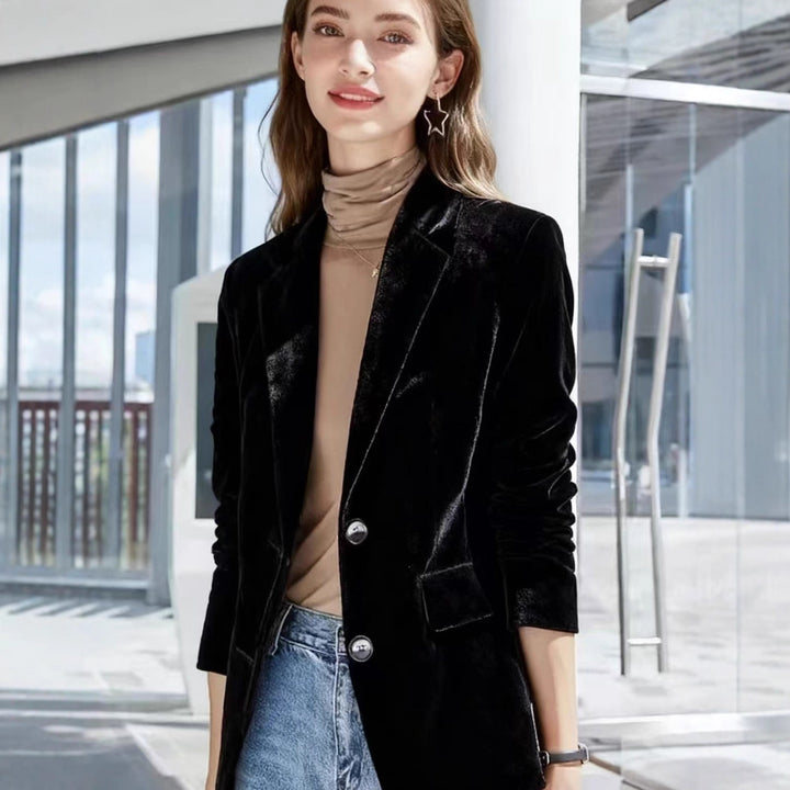 Women's narrow-cut velvet blazer with extended hem, flap pockets, and polished buttons Mune Fashion