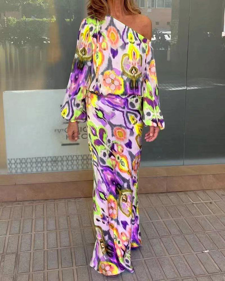 Women’s maxi dress with asymmetric one-shoulder, wide trumpet sleeves, and flowing satin print.