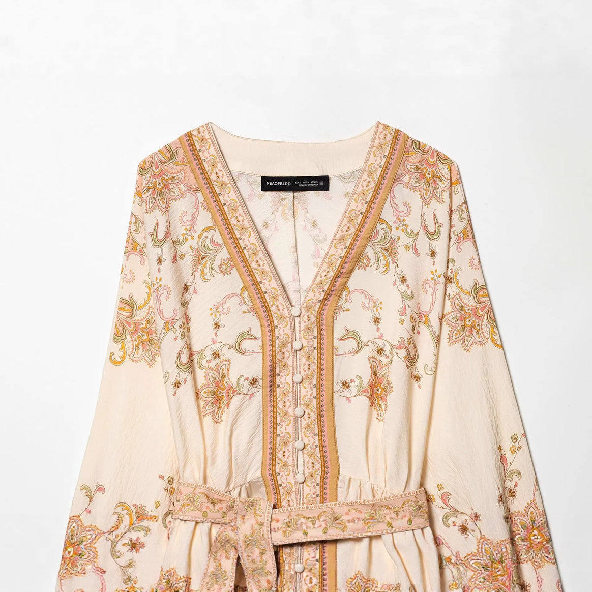 Women's embroidered Boho mini dress with deep V-neck, continuous button placket, figure-flattering tie belt, and balloon sleeves Mune Fashion