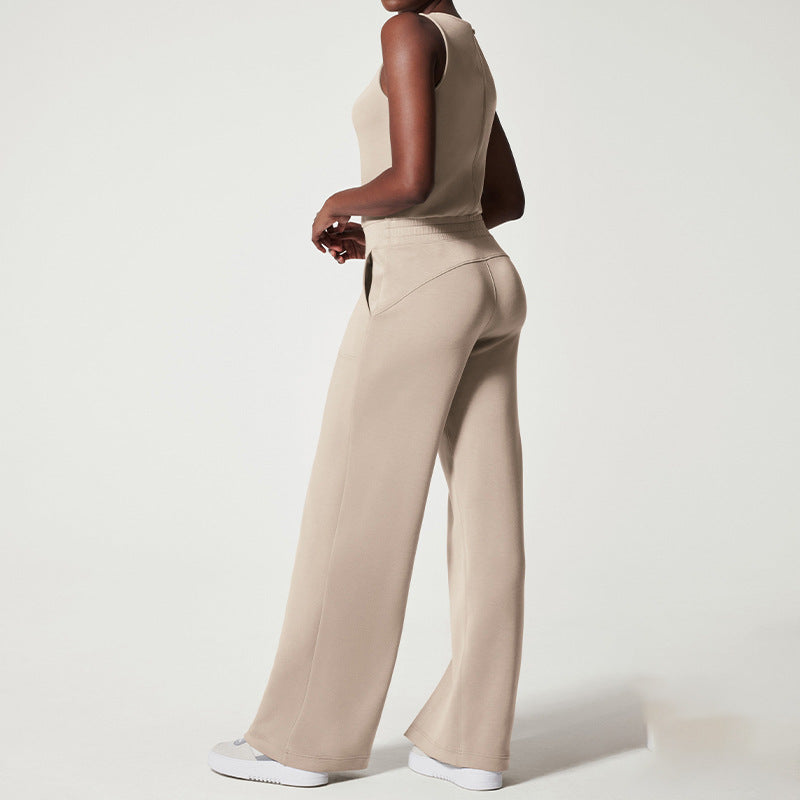 Women's sleeveless knitted jumpsuit with wide palazzo legs, drawstring waistband, and patch pockets Mune Fashion