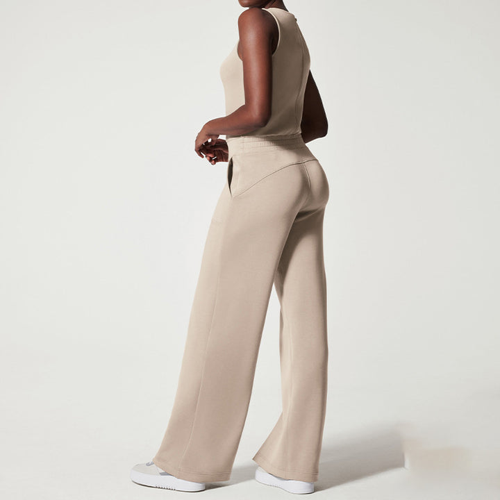 Women's sleeveless knitted jumpsuit with wide palazzo legs, drawstring waistband, and patch pockets Mune Fashion