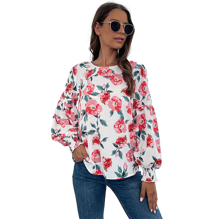 Ladies lightweight blouse with large floral print, volume sleeves and smocked cuffs Mune Fashion