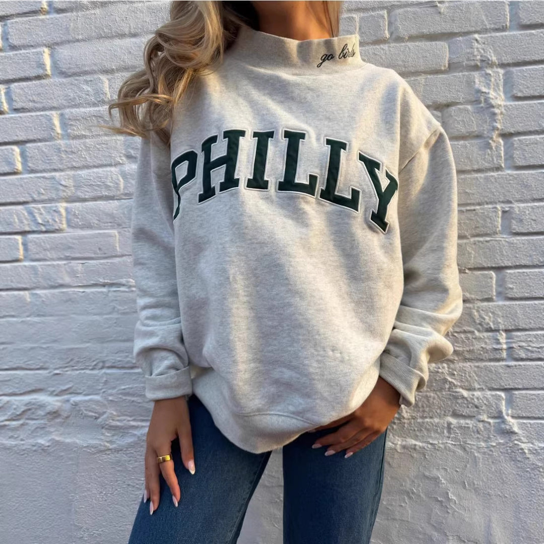 Women's oversized college sweatshirt with high stand-up collar and sewn-on lettering Mune Fashion