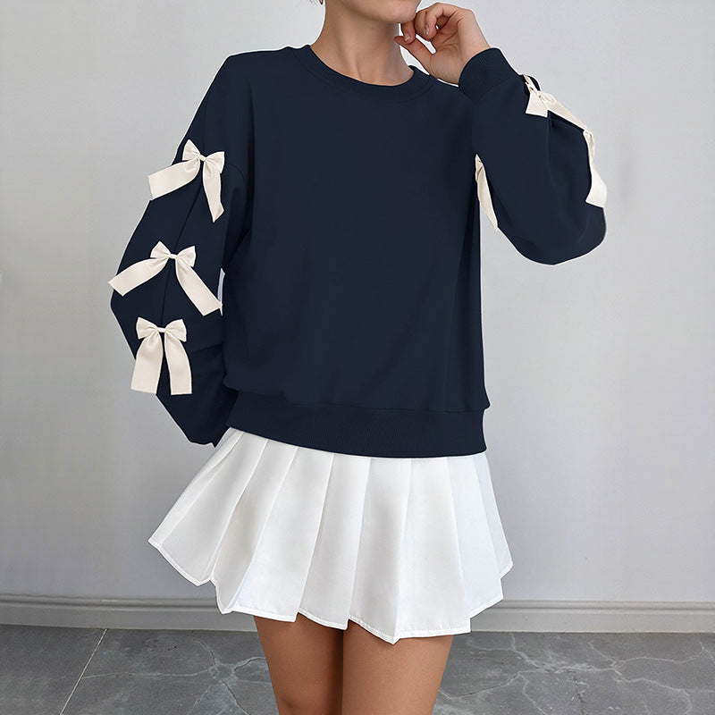 Women's sweatshirt with decorative bows on the sleeves Mune Fashion