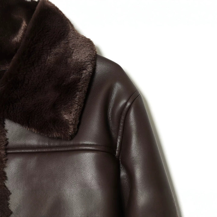 Women's short jacket in lambskin look with fur collar, patch pockets and button placket Mune Fashion