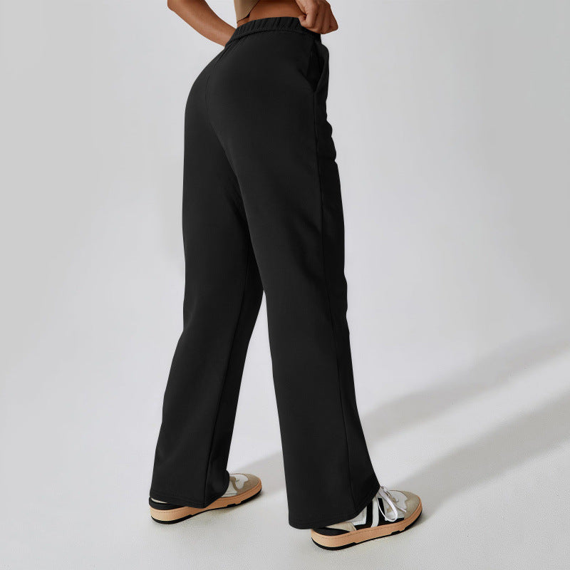Women's high-cut loose jogging pants made of soft sweat fabric with elastic waistband and side pockets Mune Fashion