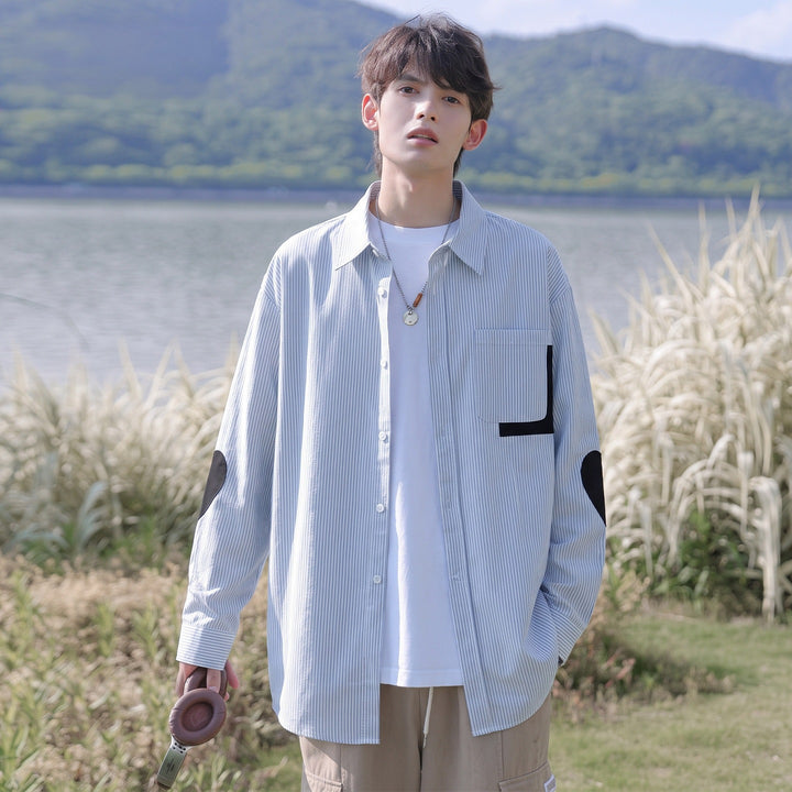 Men's oversized shirt with fine pinstripe, contrast pocket, and elbow patches Mune Fashion