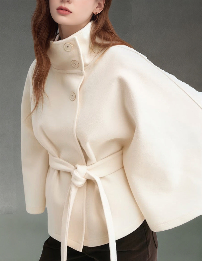 Women's short cape jacket with high stand-up collar, tie belt and boxy silhouette Mune Fashion