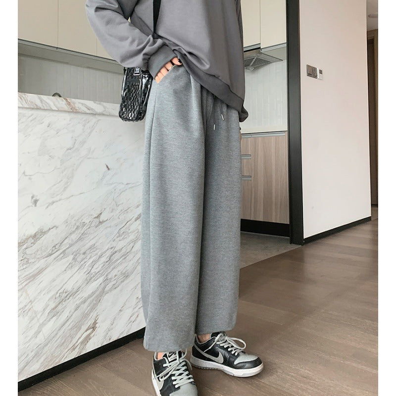 Women's relaxed-fit sweatpants with elastic drawstring waistband, side pockets, and stitched hem seams Mune Fashion
