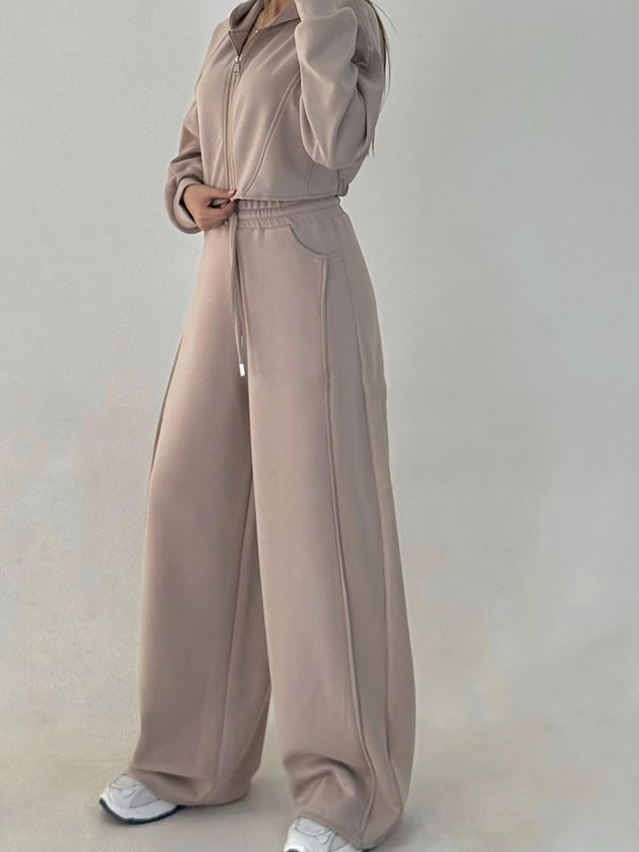 Women's loose high-waist lounge pants with drawstring, side pockets, and decorative seams Mune Fashion