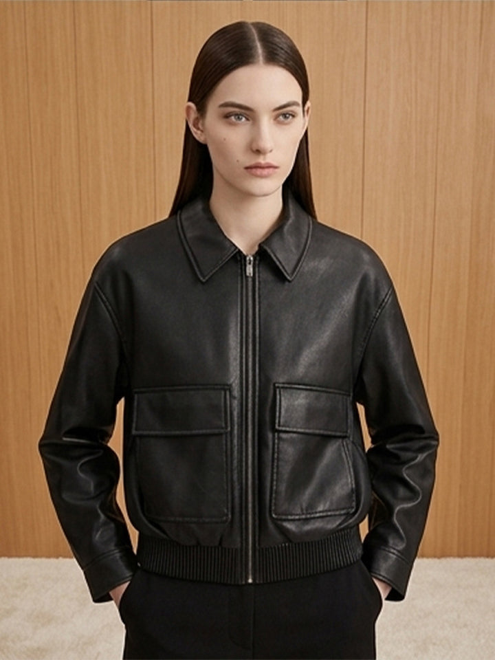 Women's short jacket made of faux leather in bomber style with ribbed hem and patch pockets Mune Fashion