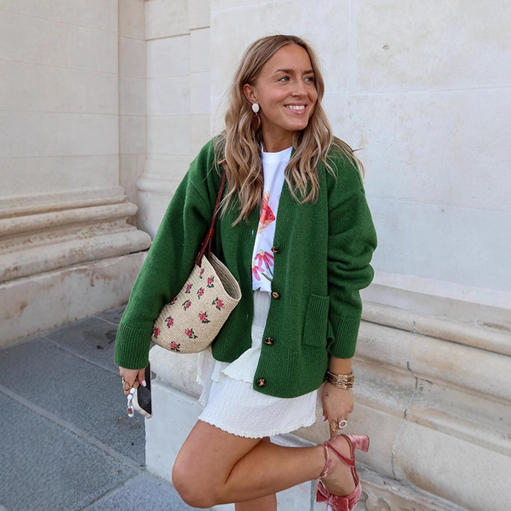 Women's oversized knit cardigan with decorative button placket, patch pockets, and elongated cuffs Mune Fashion