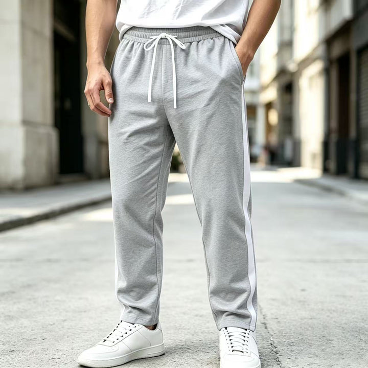 Men's jogging pants with side contrast stripe, elastic waistband and drawstring Mune Fashion