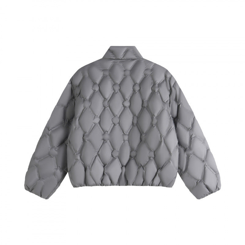 Unisex short cut quilted jacket in boxy cut with diamond quilting and diagonal zip pockets Mune Fashion