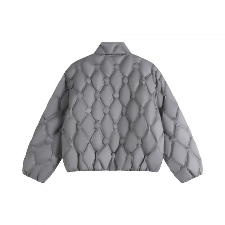 Unisex short cut quilted jacket in boxy cut with diamond quilting and diagonal zip pockets Mune Fashion