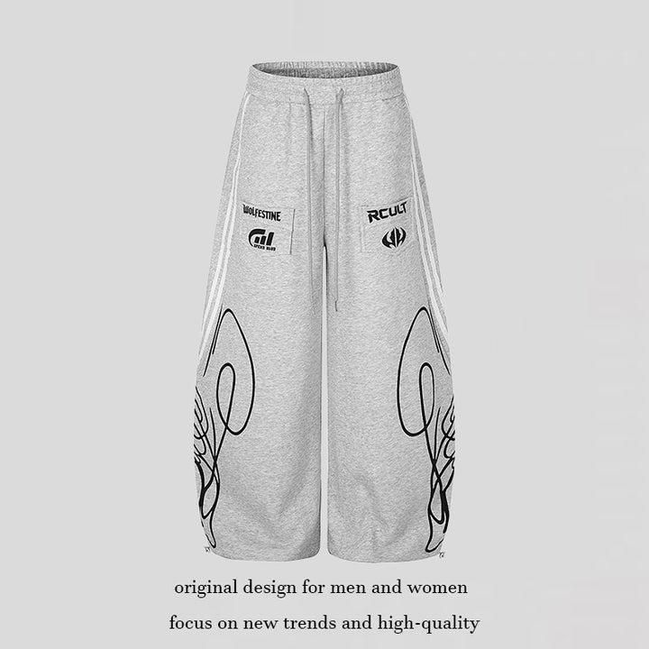 Women's Wide Midi Lounge Sweatpants in Palazzo Cut with Drawstring, Zip Hem and Statement Print Mune Fashion