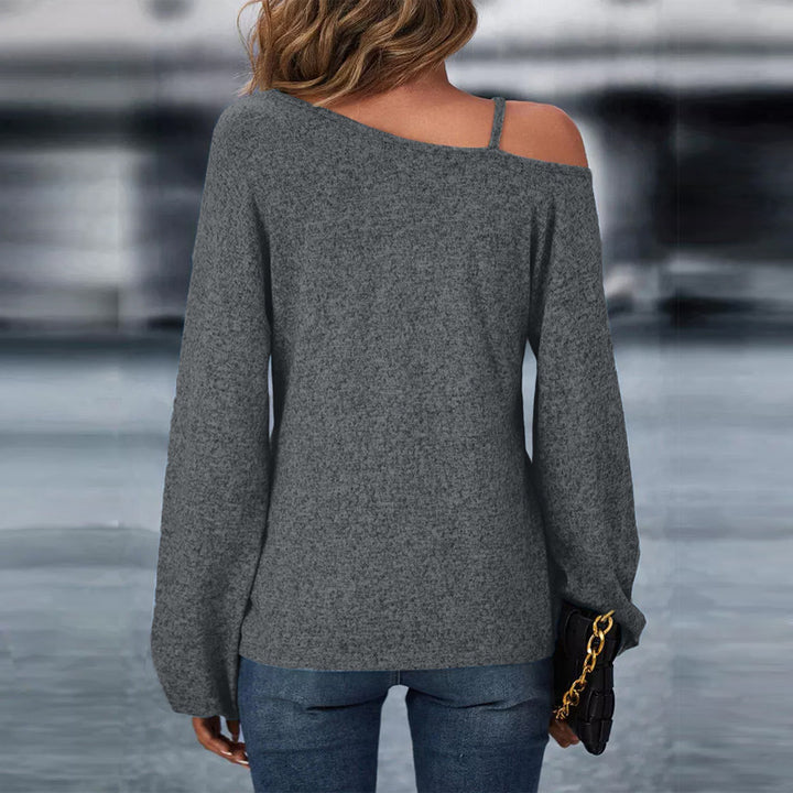 Women’s asymmetrical off-shoulder knit sweater with decorative chain strap and twisted knot front Mune Fashion