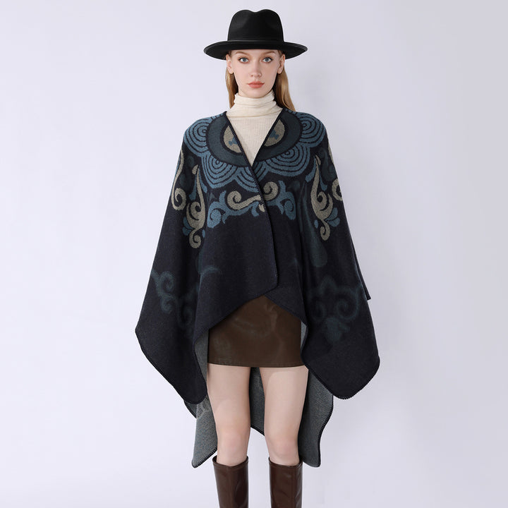 Women's wool blend cape with ornamental jacquard, asymmetrical tip and soft falling oversized drape.